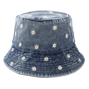 Navy blue denim bucket hat with white daisy embroidery and sun protection brim