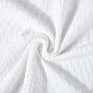 Detailed macro shot of white ribbed knit fabric texture with high elasticity and soft finish
