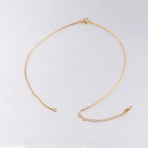 Detail of 2mm gold stainless steel cable chain necklace with extension and lobster clasp