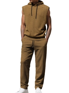 Front view of men's sleeveless hoodie and matching joggers set in mustard yellow earth tone