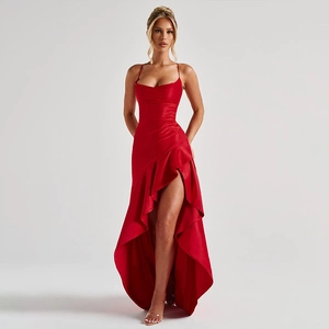 Detail of red satin dress with spaghetti straps and high slit ruffled hemline