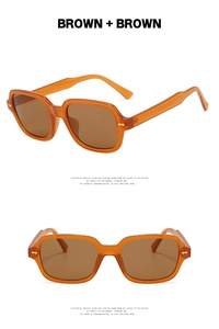Detail view of retro square sunglasses in amber brown with premium metallic accents