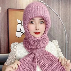 Close-up of pink knit hood scarf showing soft squirrel wool texture on a female model