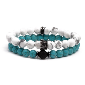 Beaded bracelet set with turquoise stones, black lava rock and a crown charm