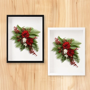 Detailed 3D hollow shadow box frame featuring festive floral art and pine cones
