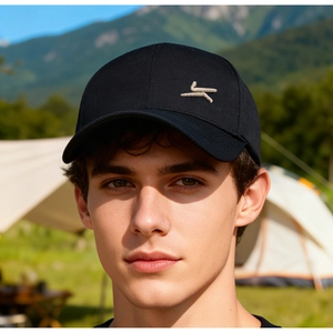 Outdoor lifestyle shot of a black baseball cap with premium embroidery logo for men