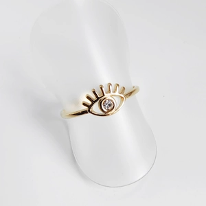 Detail of 18K gold-plated titanium evil eye ring with sparkling cubic zirconia inlay