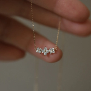 Elegant gold S925 sterling silver necklace with a sparkling diamond flower clover pendant
