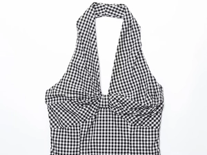 Detailed view of black and white gingham halter top with pleated knot design