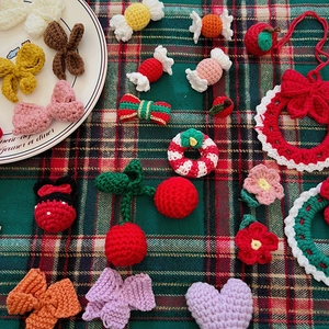 Assorted handmade crochet Christmas ornaments and miniature DIY craft accessories