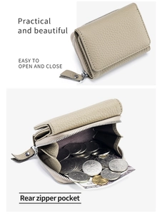 Detail of beige leather wallet with rear silver zipper pocket for coin storage