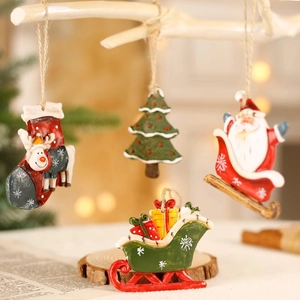 Christmas tree ornaments set featuring resin Santa, reindeer socks, and sled decorations