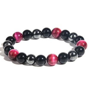 Detailed view of beaded bracelet with black onyx, pink tiger eye and metallic hematite beads