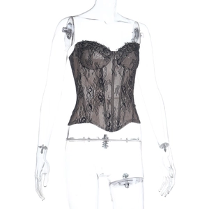 Close-up of black floral lace texture and corset detailing on a strapless bustier top