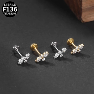 F136 titanium flat back labret studs with zircon butterfly and flower designs in gold and silver