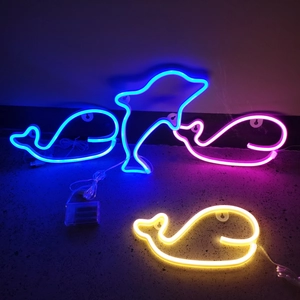 Detail of LED dolphin and whale neon signs with USB and battery power options