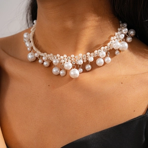 Close-up of elegant baroque pearl choker necklace with sparkling crystal rhinestones