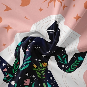 Detail of bohemian tapestry featuring celestial elements and artistic floral illustrations