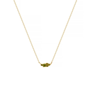 Detail of gold necklace featuring five graduated round green gemstones on a delicate link chain
