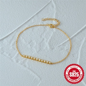 Elegant S925 sterling silver gold bracelet with twelve sparkling round-cut zircon stones