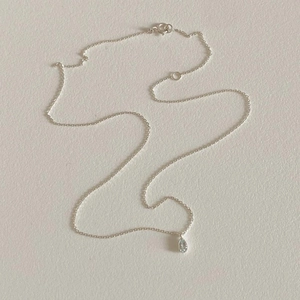 Minimalist 925 sterling silver necklace with teardrop-shaped light blue gemstone pendant