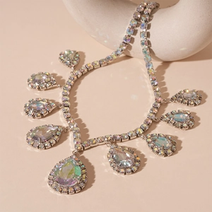 Luxury water drop teardrop geometric necklace with shimmering crystals in silver finish