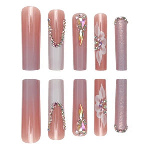 Coffin-shaped press-on nails in dusty rose with 3D flowers, rhinestones and purple glitter