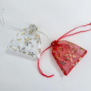Red and white organza drawstring gift bags with gold snowflake foil print for Christmas