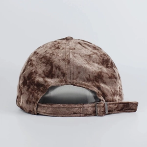 Brown faux suede baseball cap featuring an adjustable back strap and metal buckle