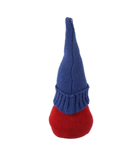 Macro detail of the red and blue knitted patriotic gnome showing high quality fabric texture