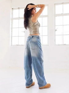 Women's vintage washed blue wide leg denim jeans in a loose fit casual street style