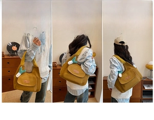Detail showing ginger canvas tote bag used as handbag, crossbody, and shoulder bag