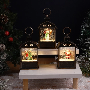 Detail of vintage Christmas lanterns with snowman and Santa scenes and LED snow motion