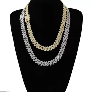 Iced out 14mm Cuban link necklaces in gold and silver finish with rhinestones on mannequin