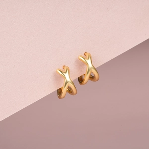 Detail of S925 silver cross earrings with golden matte brushed texture and clear hallmark