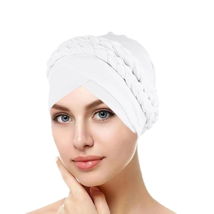 Close-up of white milk silk turban showing detailed double-braided knit design on forehead