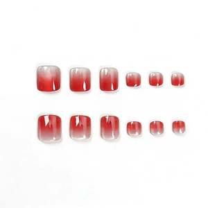 Faux ongles d'orteils carrés à dégradé rouge œil de chat et finition brillante