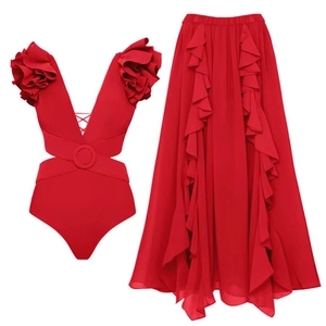 Detail of red deep-V swimsuit and ruffled maxi skirt set with 3D floral accents