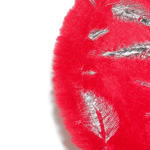 Macro detail of red long faux fur texture with elegant silver feather foil print pattern
