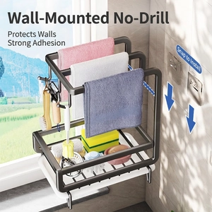Wall-mounted grey kitchen organizer with towel bars and drainage basket for sponges