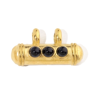Detail of vintage gold-plated titanium steel pendant with black natural stone beads