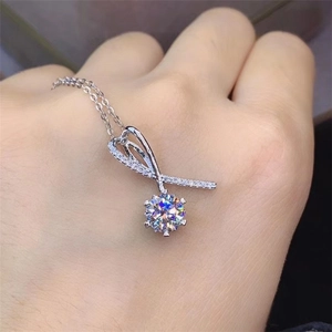 Macro shot of 2 carat Moissanite ribbon pendant on a silver-plated Pt950 necklace
