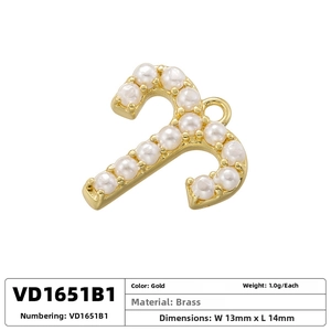 Macro view of gold-plated brass letter pendant with inlaid pearls and dimensions