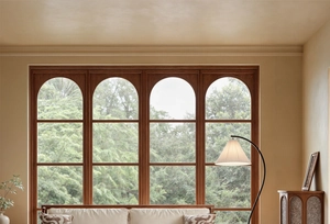 French vintage dark wood arched windows overlooking a lush green garden view