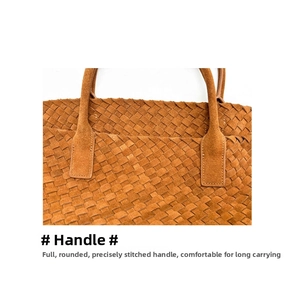 Detail of hand-woven brown suede leather tote showing the sturdy handle connection