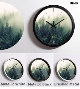 Detail of silent metal wall clock frames in white, black and brushed silver finishes