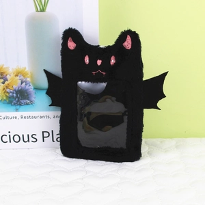Close-up of plush black bat card holder with pink embroidery and clear photo window