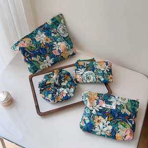 Floral cotton pouch set with three sizes of organizers and a matching hair scrunchie