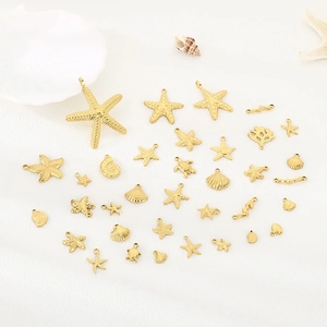 Golden stainless steel ocean-themed charms set featuring sea stars, shells and turtles