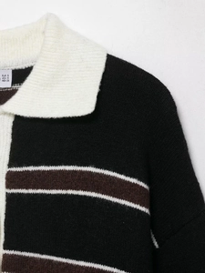 Detail shot of the POLO collar and striped knit fabric texture with size label